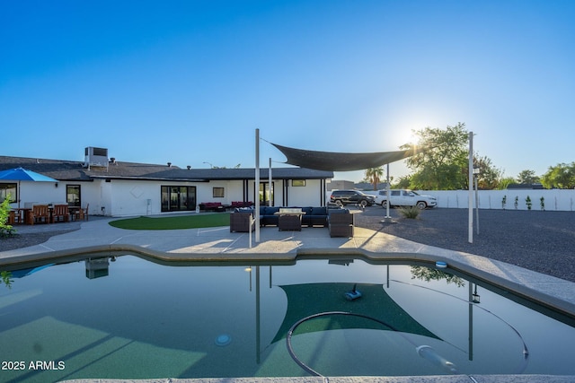view of swimming pool featuring a fenced in pool, a fenced backyard, outdoor lounge area, and a patio area