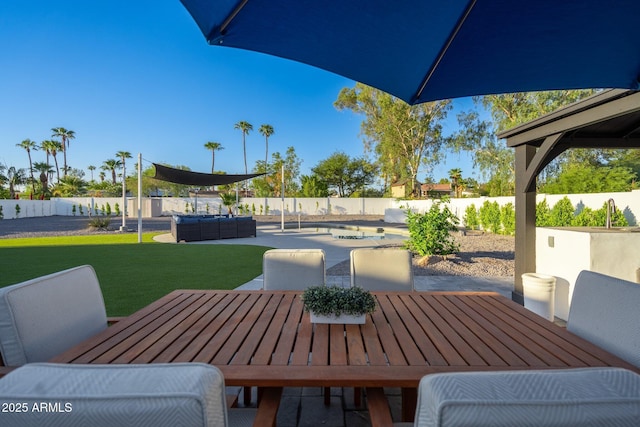 view of patio featuring a pool, outdoor dining area, a fenced backyard, and an outdoor hangout area