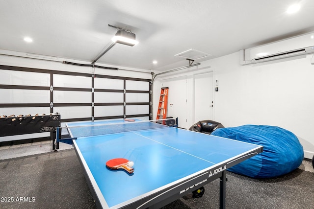 game room featuring a garage, recessed lighting, and a wall unit AC