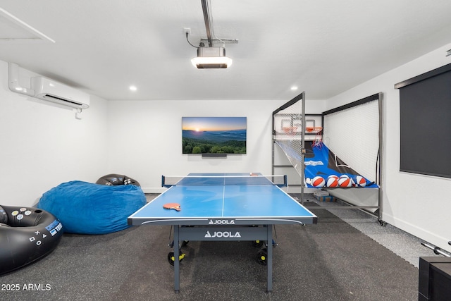 game room featuring an AC wall unit, recessed lighting, and baseboards