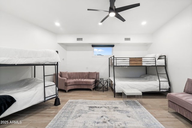 bedroom with recessed lighting, visible vents, and wood finished floors