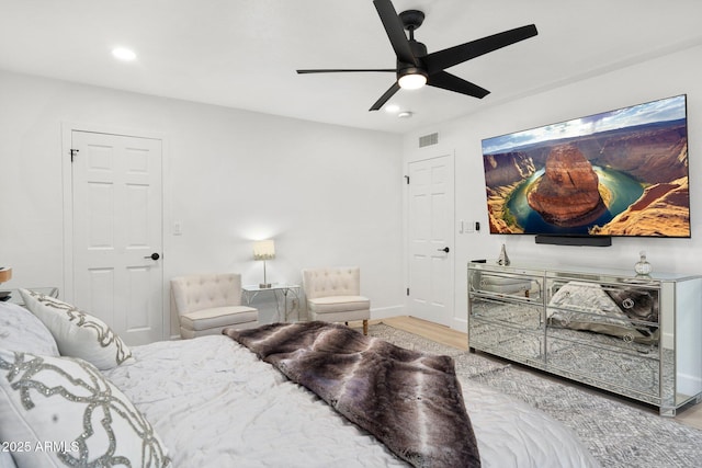 bedroom featuring recessed lighting, ceiling fan, visible vents, and wood finished floors