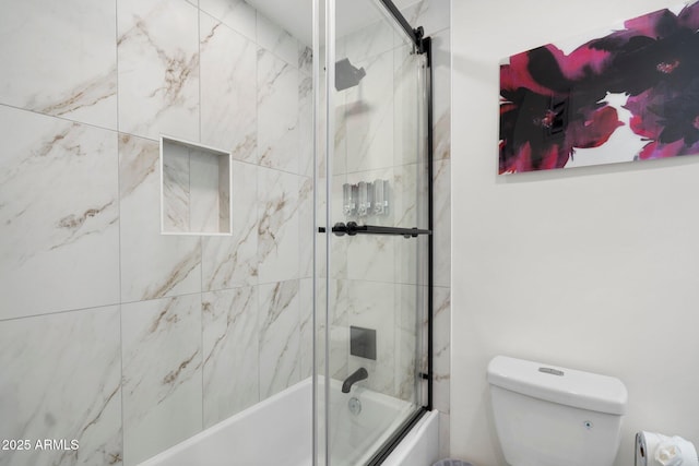 bathroom with toilet and enclosed tub / shower combo