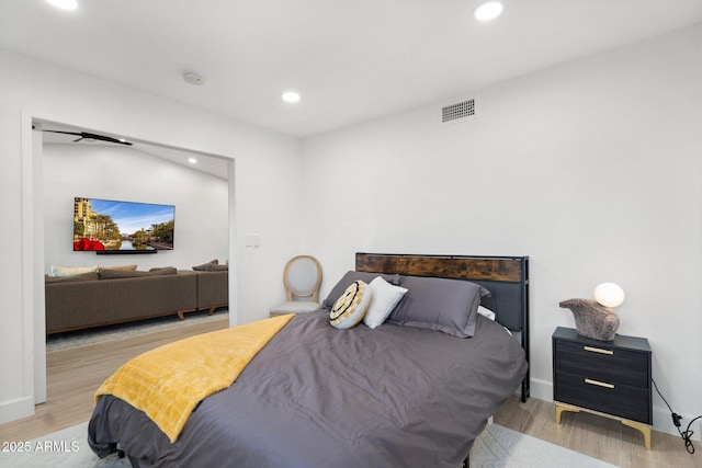 bedroom featuring recessed lighting, wood finished floors, and visible vents