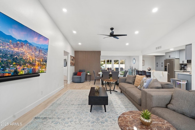living area with ceiling fan, visible vents, light wood-type flooring, baseboards, and recessed lighting
