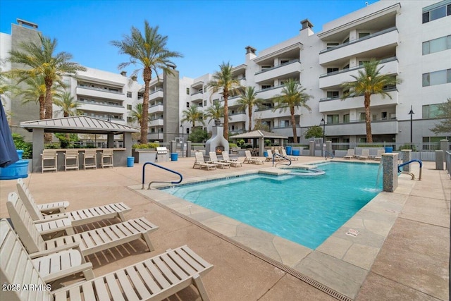 945 E Playa Del Norte Dr Unit 1016, Tempe, AZ 85288 - view of pool featuring a gazebo, a patio area, exterior bar, and a pool with connected hot tub