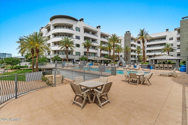 945 E Playa Del Norte Dr Unit 1016, Tempe, AZ 85288 - community pool featuring a gazebo, a patio area, and outdoor dining area