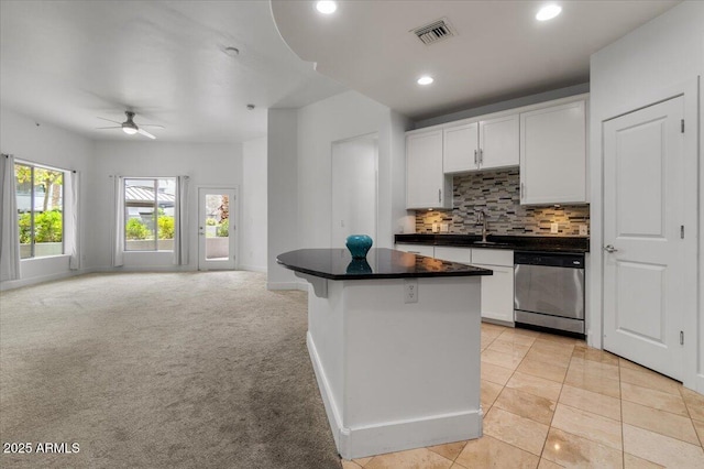 945 E Playa Del Norte Dr Unit 1016, Tempe, AZ 85288 - kitchen with stainless steel dishwasher, open floor plan, a center island, ceiling fan, and decorative backsplash