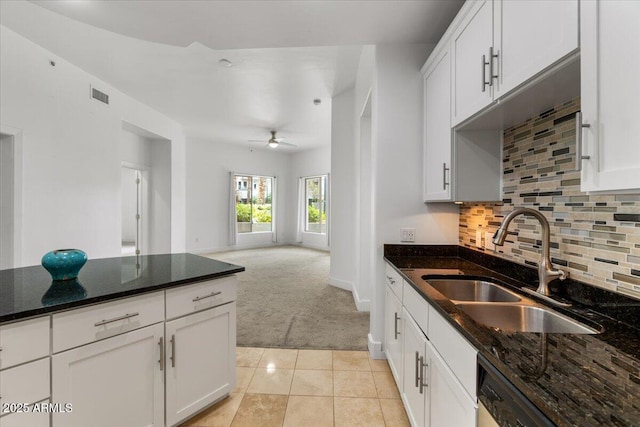 945 E Playa Del Norte Dr Unit 1016, Tempe, AZ 85288 - kitchen featuring light carpet, dishwasher, tasteful backsplash, dark stone counters, and a ceiling fan