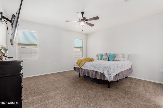 carpeted bedroom with baseboards and ceiling fan