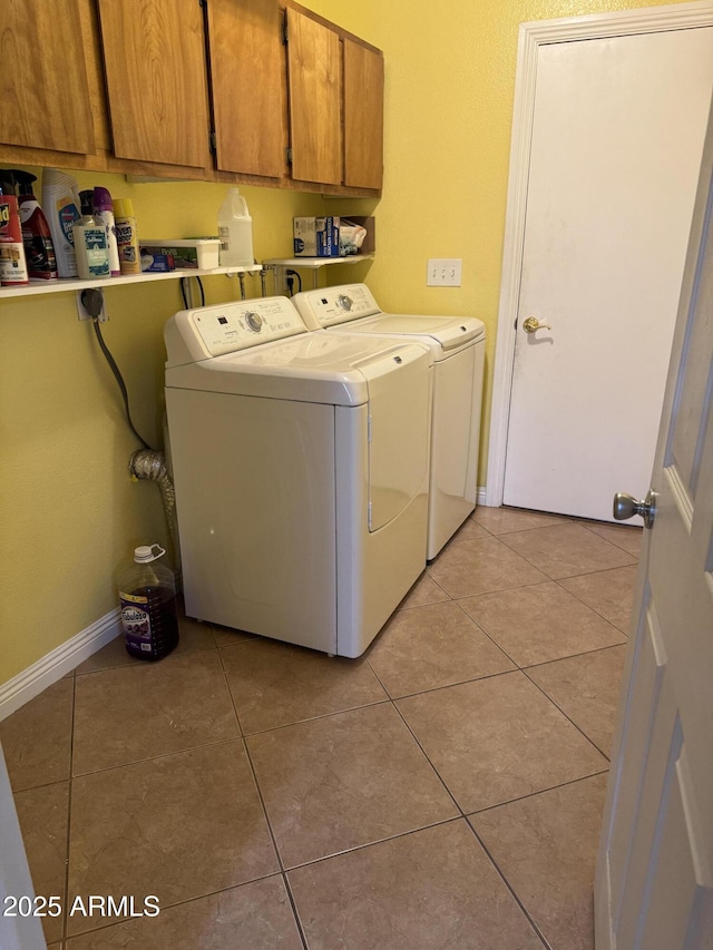 11221 N 91st Dr, Peoria, AZ 85345 - washroom with separate washer and dryer, cabinet space, light tile patterned floors, and baseboards