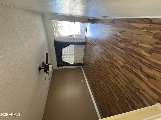 11221 N 91st Dr, Peoria, AZ 85345 - spare room featuring a textured wall and a textured ceiling