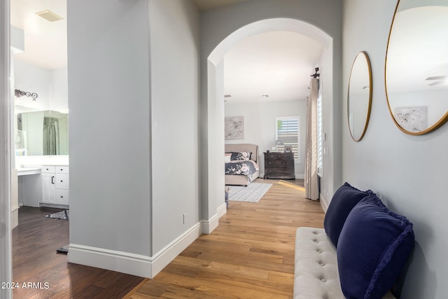 hall with light hardwood / wood-style flooring