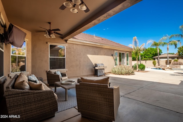 view of patio featuring ceiling fan, area for grilling, and an outdoor hangout area