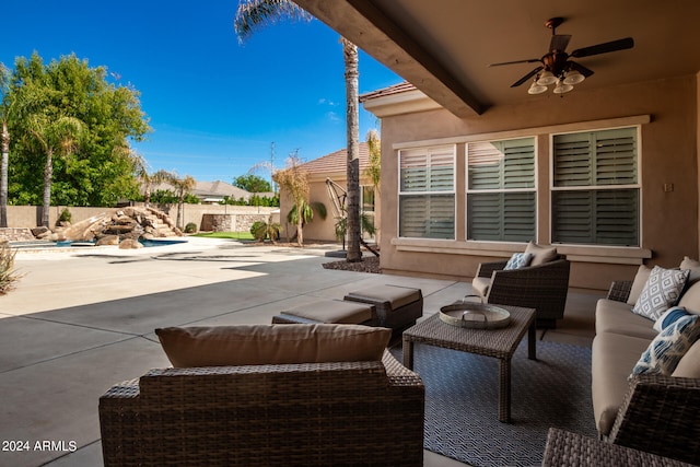 view of patio / terrace with ceiling fan and an outdoor living space