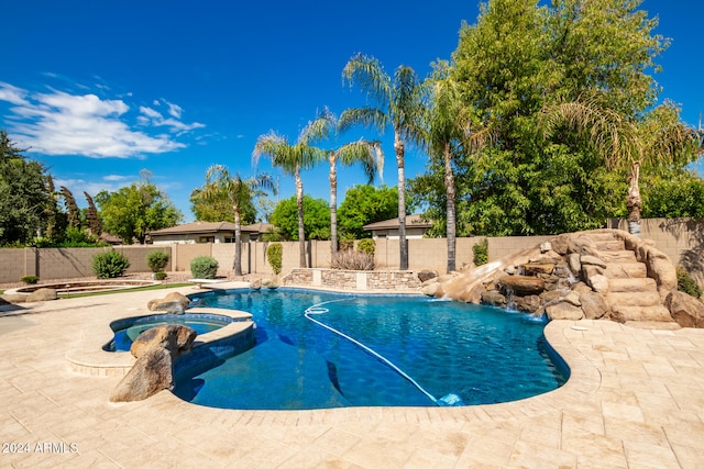 view of swimming pool featuring an in ground hot tub, a patio, and pool water feature