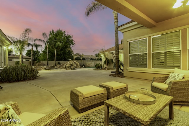 view of patio terrace at dusk