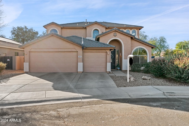 2811 E Riviera Pl, Chandler, AZ 85249 - mediterranean / spanish house with an attached garage, stucco siding, and concrete driveway