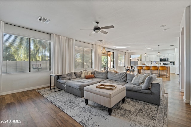2811 E Riviera Pl, Chandler, AZ 85249 - living area featuring ceiling fan, wood finished floors, baseboards, and plenty of natural light