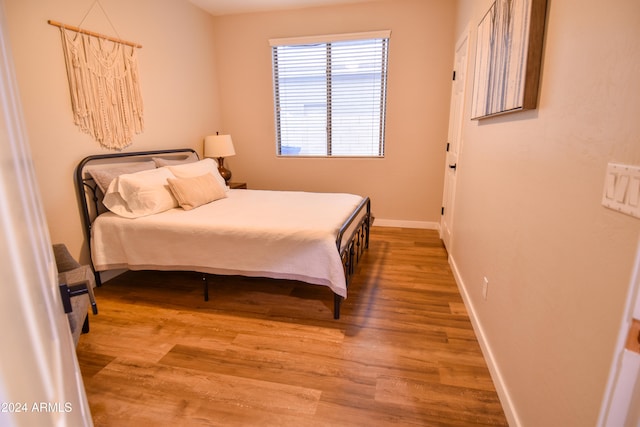 bedroom featuring hardwood / wood-style flooring