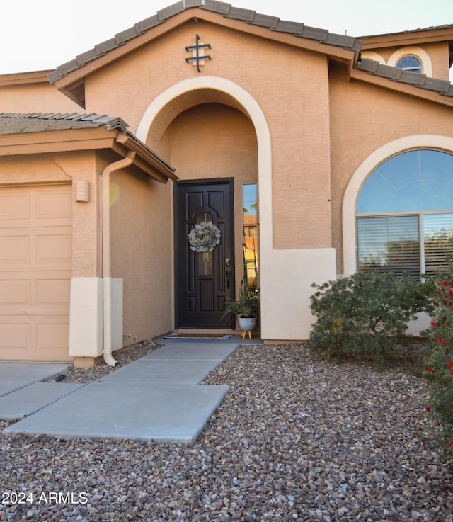 property entrance with a garage