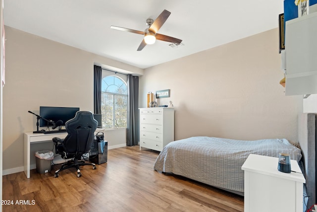2811 E Riviera Pl, Chandler, AZ 85249 - bedroom with wood finished floors, an office area, and baseboards