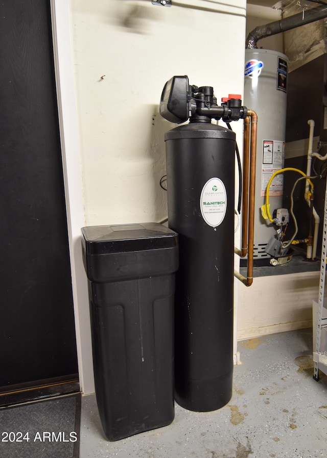 utility room featuring water heater