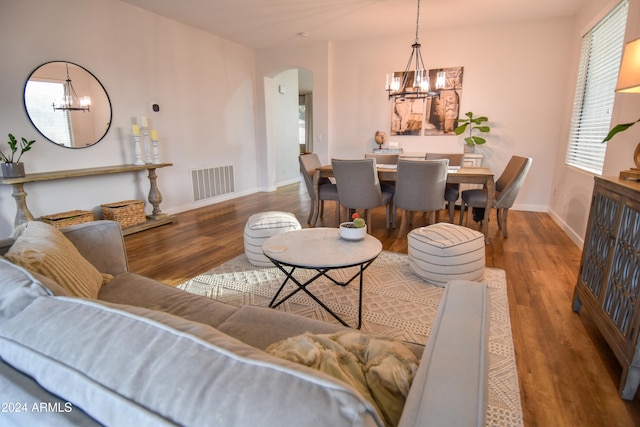 living room featuring a chandelier and hardwood / wood-style flooring