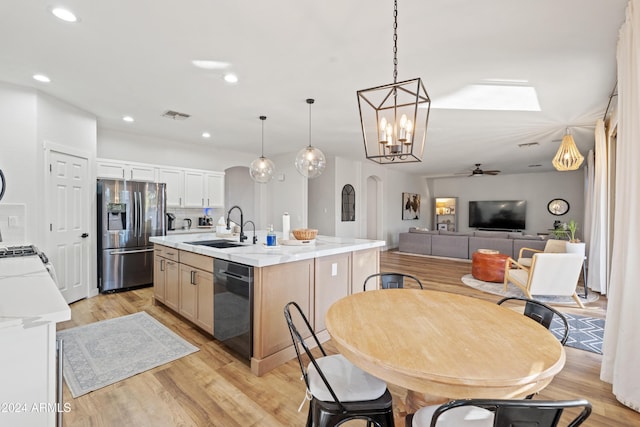 2811 E Riviera Pl, Chandler, AZ 85249 - kitchen with stainless steel fridge with ice dispenser, dishwasher, a sink, a kitchen island with sink, and light wood finished floors