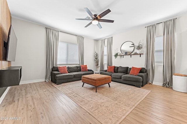 living room with ceiling fan, light hardwood / wood-style flooring, and plenty of natural light