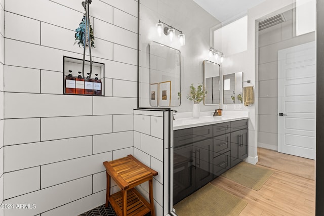 bathroom featuring hardwood / wood-style flooring and vanity