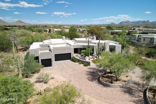 birds eye view of property featuring a mountain view