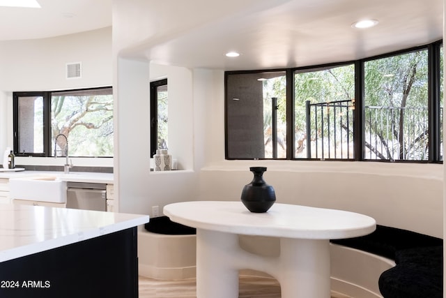bathroom with wood finished floors, recessed lighting, and visible vents