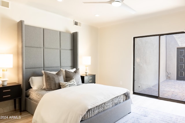 bedroom with ceiling fan, access to exterior, and light hardwood / wood-style flooring