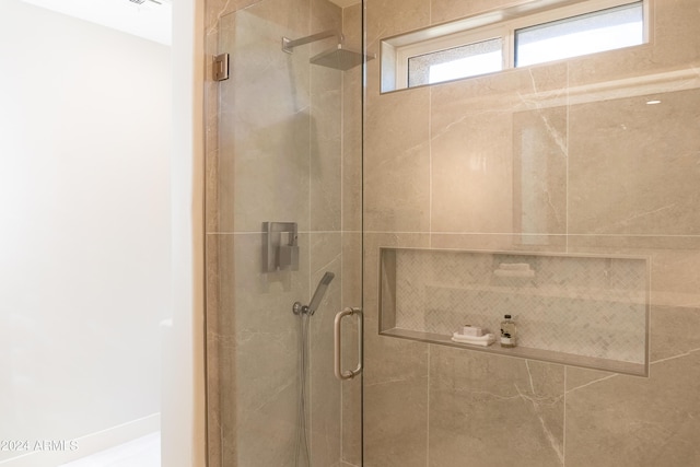bathroom with a shower stall