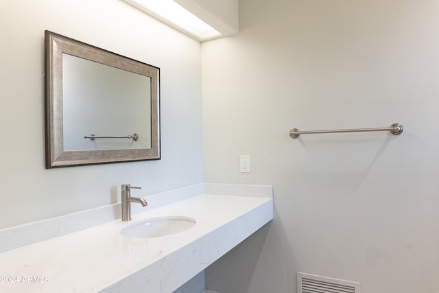 bathroom featuring visible vents and vanity
