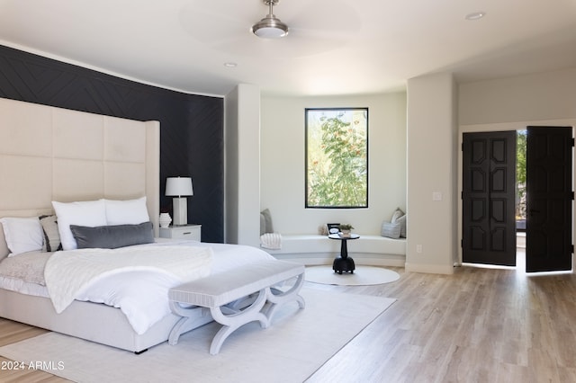 bedroom featuring hardwood / wood-style floors and ceiling fan