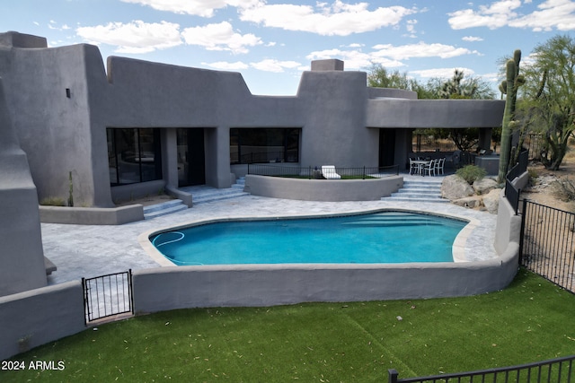 view of swimming pool with a patio area