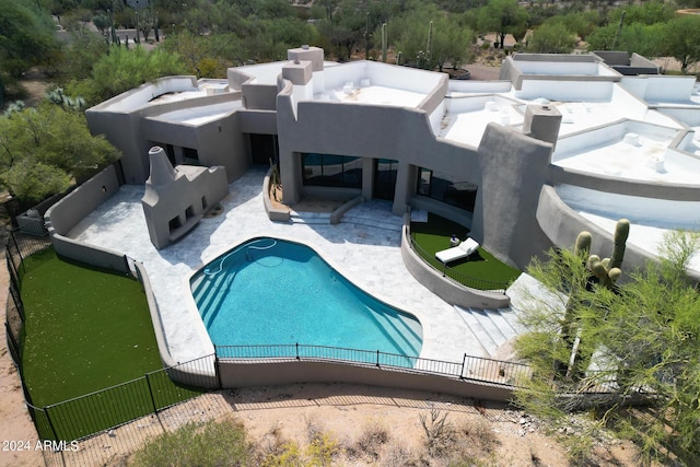 view of swimming pool with a fenced backyard, a fenced in pool, and a patio area