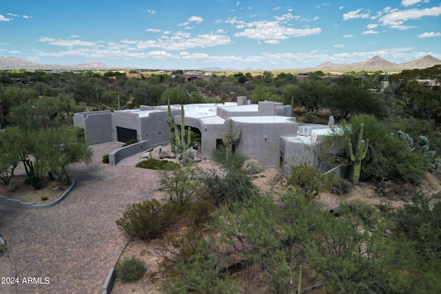 birds eye view of property featuring a mountain view