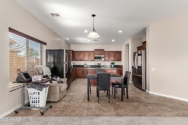 kitchen featuring baseboards, visible vents, stainless steel appliances, and recessed lighting