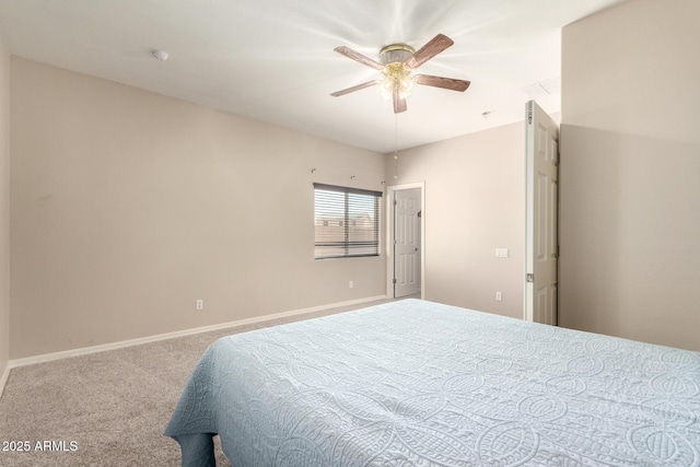 carpeted bedroom with ceiling fan and baseboards