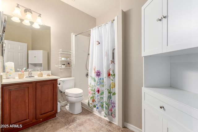 bathroom featuring vanity, toilet, and tile patterned floors