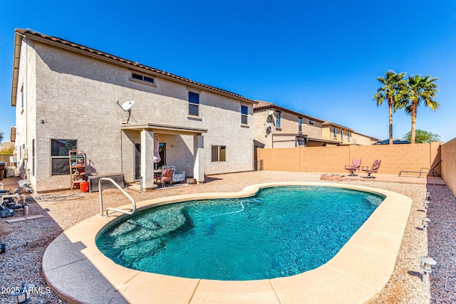 view of swimming pool featuring a patio, a fenced backyard, and a fenced in pool