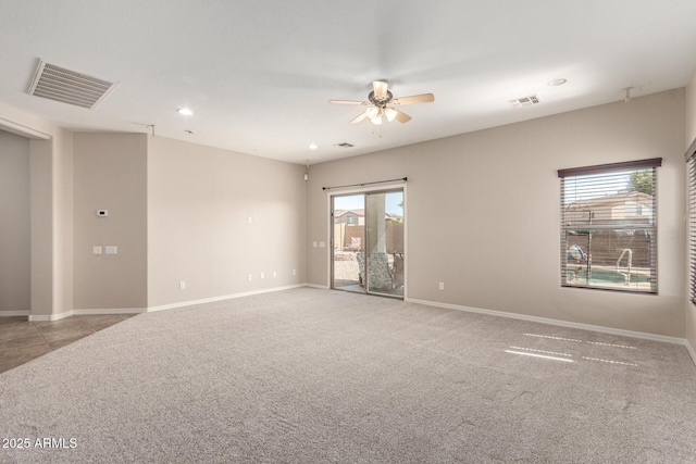 carpeted empty room featuring recessed lighting, visible vents, ceiling fan, and baseboards