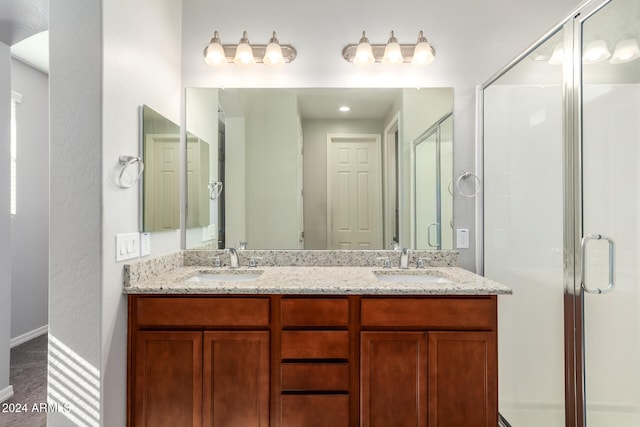 bathroom with vanity and an enclosed shower