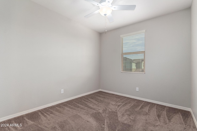 unfurnished room with carpet and ceiling fan