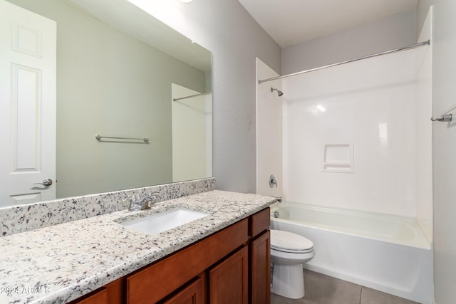 full bathroom featuring tile patterned floors, vanity, tub / shower combination, and toilet