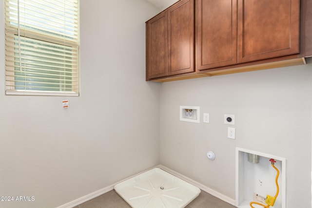 washroom with cabinets, washer hookup, hookup for a gas dryer, and hookup for an electric dryer