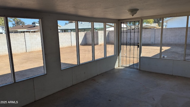 unfurnished sunroom with plenty of natural light